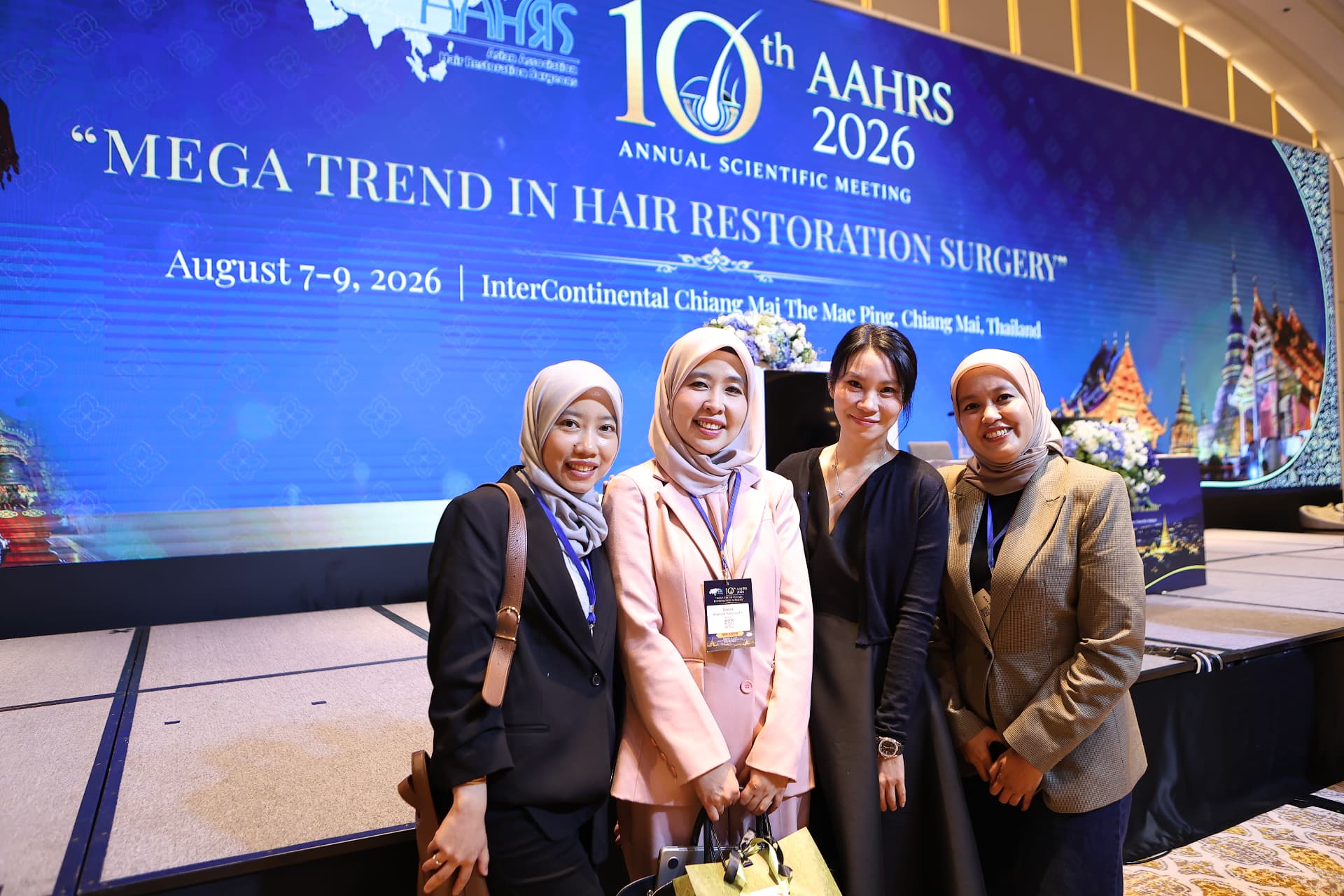 Thrive Hair Clinic doctors with colleagues at the AAHRS 2026 conference in Chiang Mai