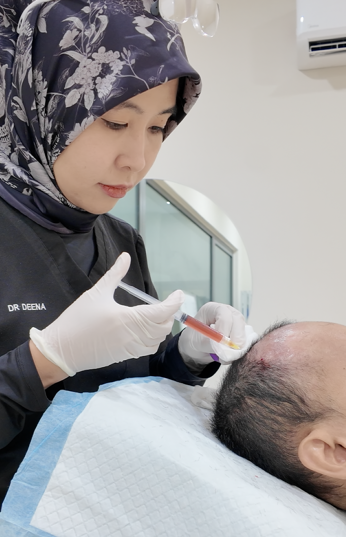 Dr Deena administering a platelet-rich plasma treatment at Thrive Hair Clinic